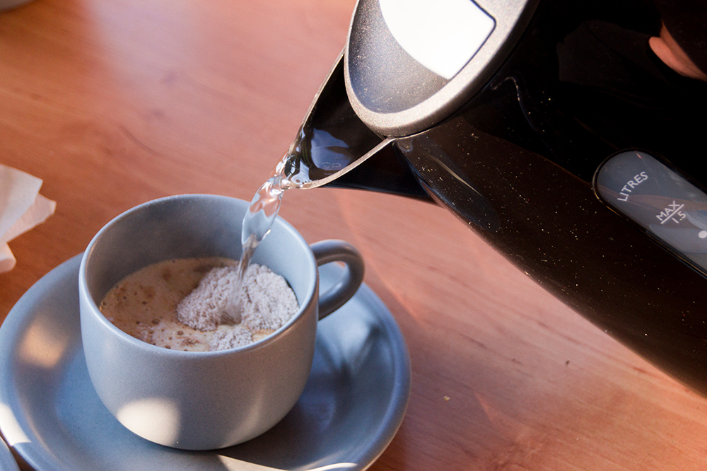 Bovine Colostrum powder infused into a cup of coffee