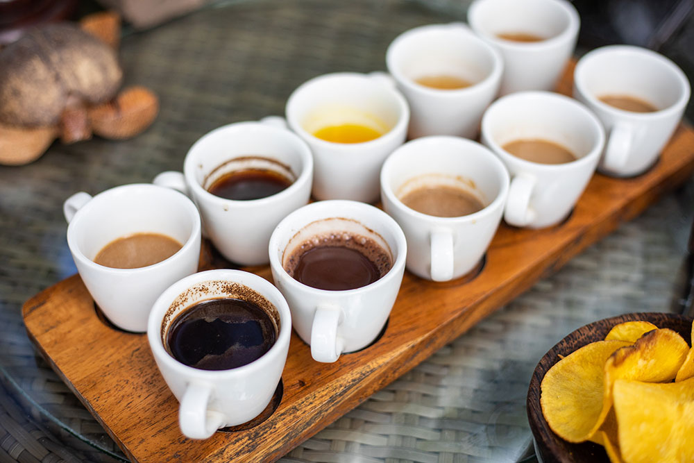several cups of flavored coffee waiting to be tasted