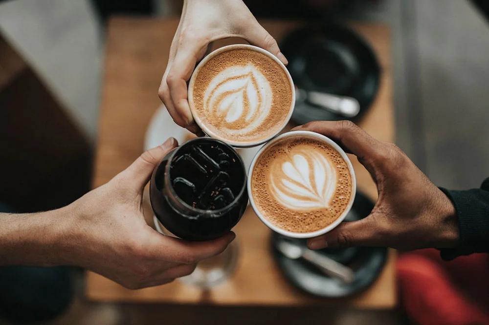 A white cup is sitting on the ground.